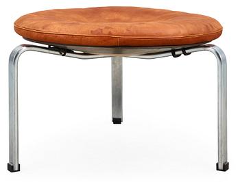 629. A Poul Kjaerholm steel and brown leather "PK-33" stool, E Kold Christensen, Denmark, maker's mark in the steel.