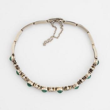 18K white gold and cabochon cut emerald and eight cut diamond bracelet.