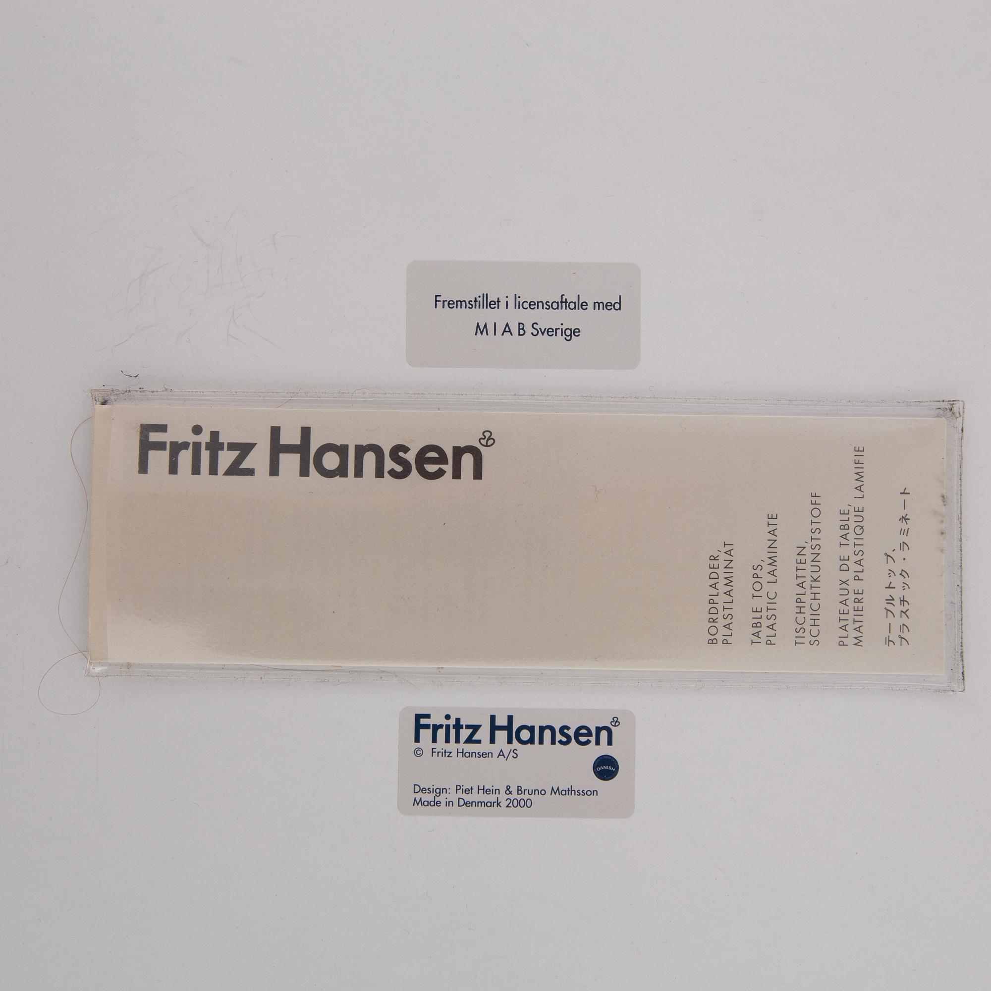 A 'Supercircle table by Bbruno Marthsson & Piet Hein for Fritz Hansen, dated 2000.