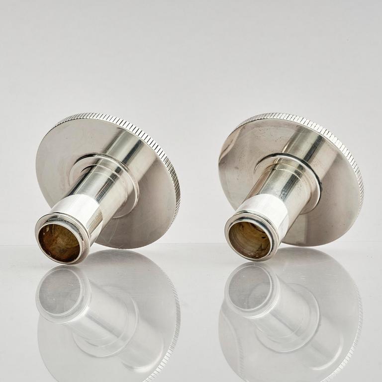 Georg Jensen, a pair of sterling silver candlesticks, design by Sigvard Bernadotte, model no 711A, Copenhagen, Denmark after 1945.