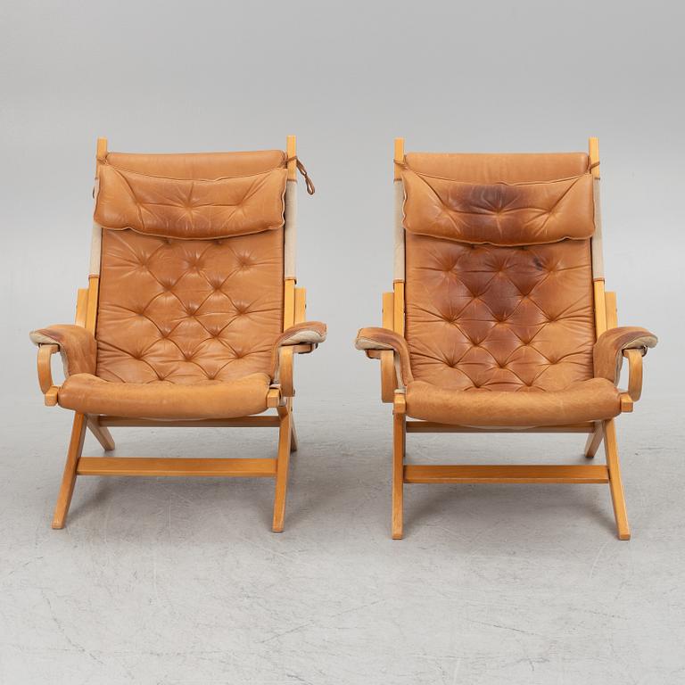 A pair of armchairs, Nielaus Møbler, Denmark, second half of the 20th Century.