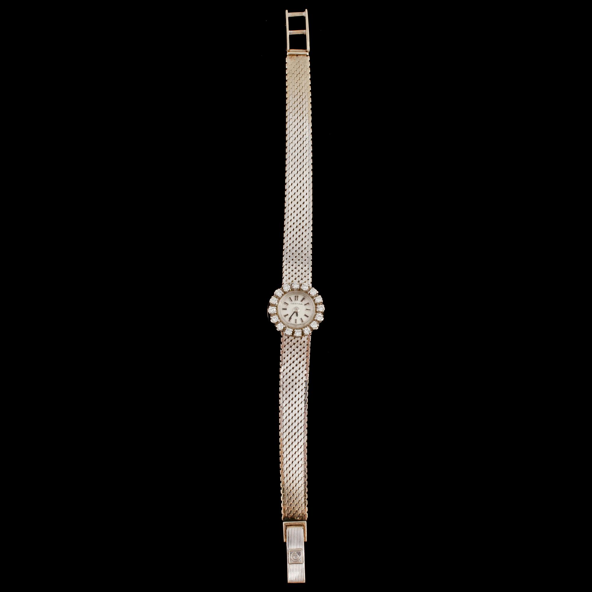 DAMARMBANDSUR, 18k vitguld, 16 briljantslipade diamanter, Certina, Schweiz, omkring 1900-talets mitt. Vikt 24 g.