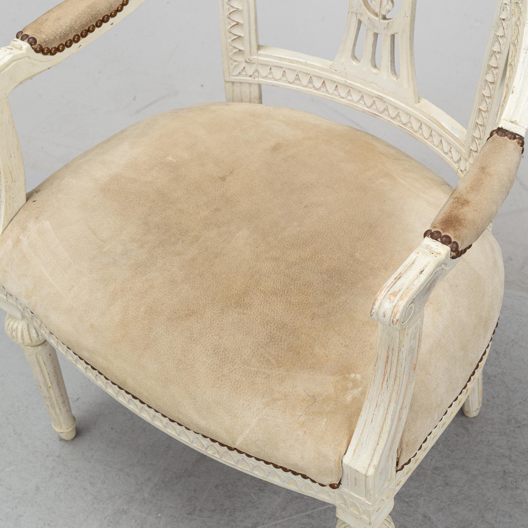 A set of two Gustavian arm chairs from the early 19th Century.