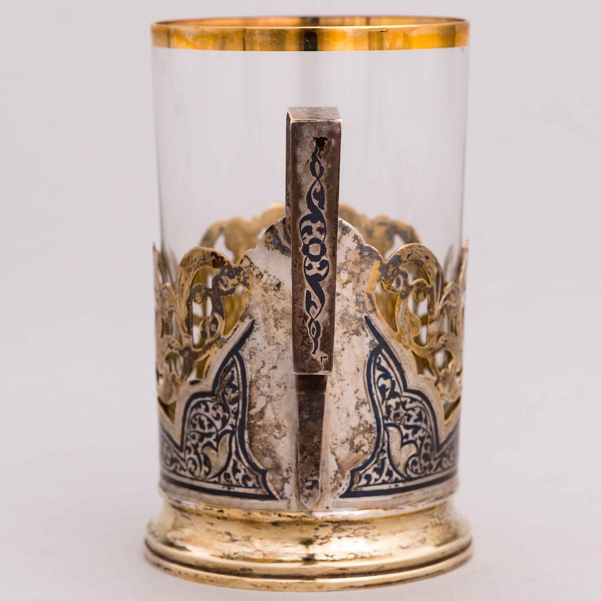 A Russian silver teaglass holder and seven teaspoons, Moscow and Kiev, first half and mid-20th Century.