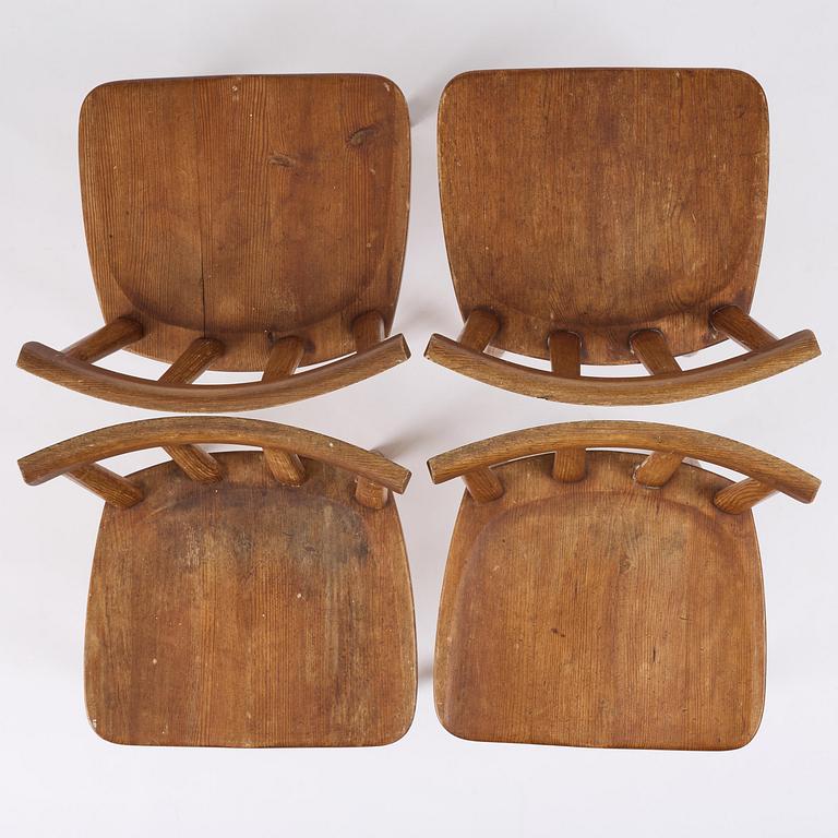 Axel Einar Hjorth, a set of four stained pine "Utö" chairs, Nordiska Kompaniet, Sweden, 1930s.