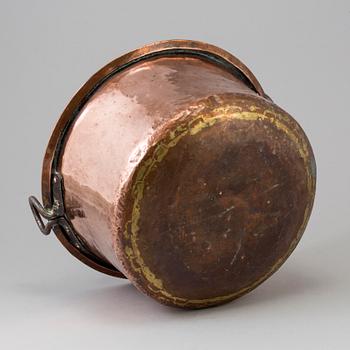 A 19th century copper cauldron.