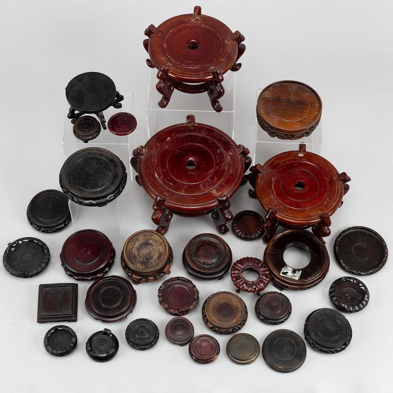 31 Chinese wooden stands of different sorts, 20th century.