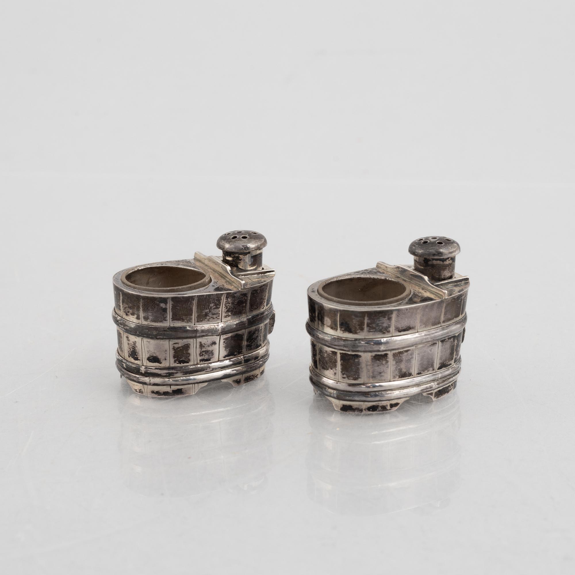 A set of three Japanese silver coasters and a pair of salts with shakers, 20th century.