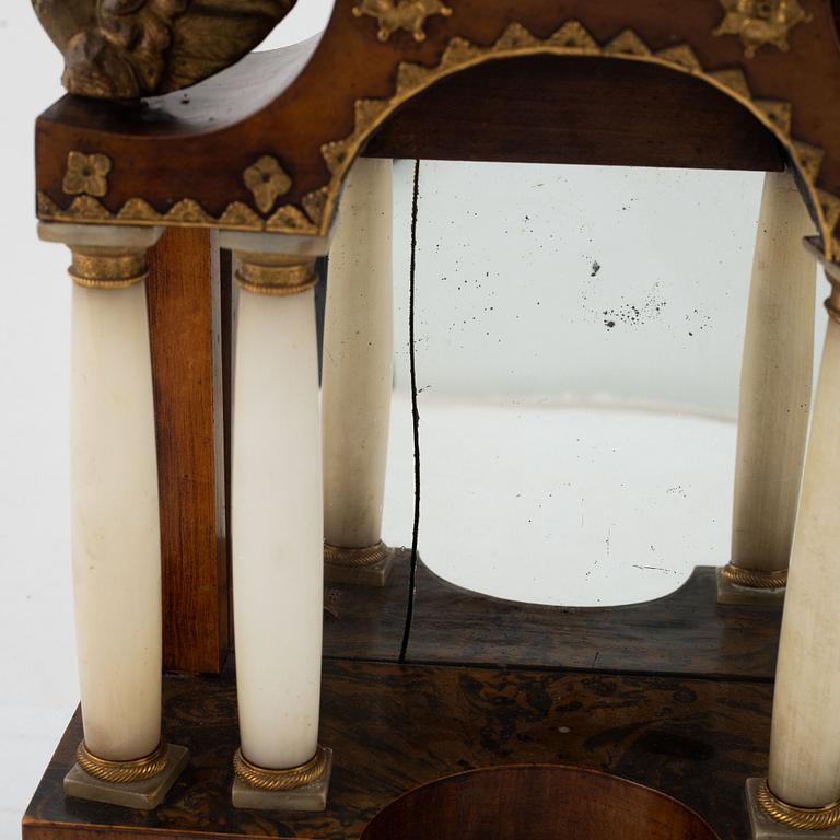 A presumably Austrian mahogany, gilt-brass, and alabaster portico mantel clock, early 19th century.