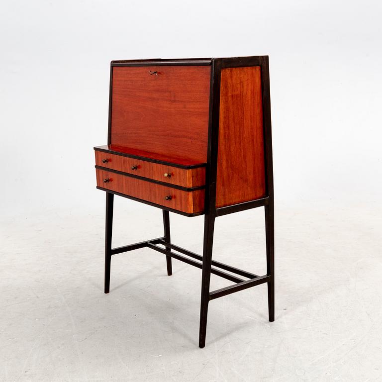 A 1950s mahogany writing desk.