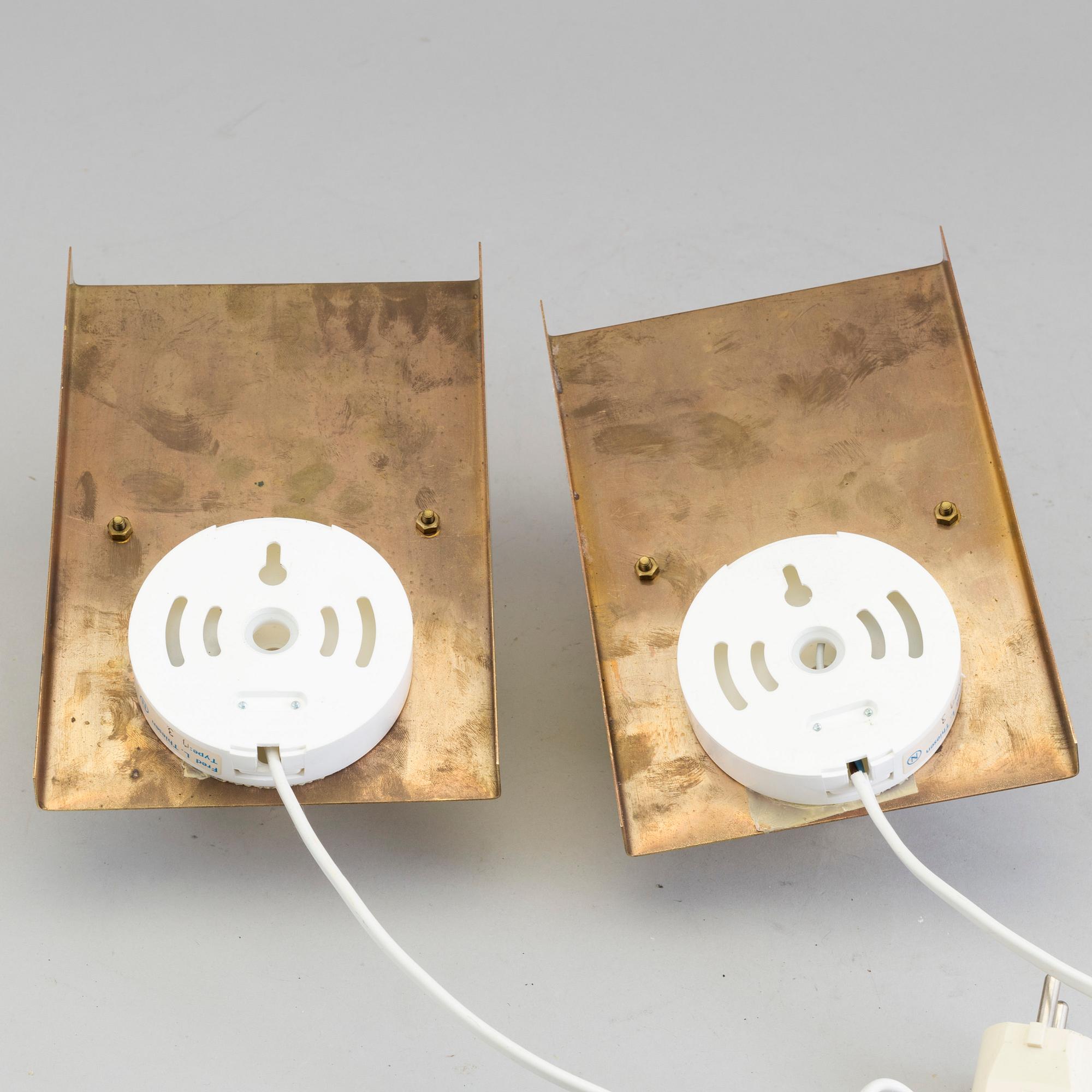 A pair of wall lights marked Fred L. Thiesen, 20th century.