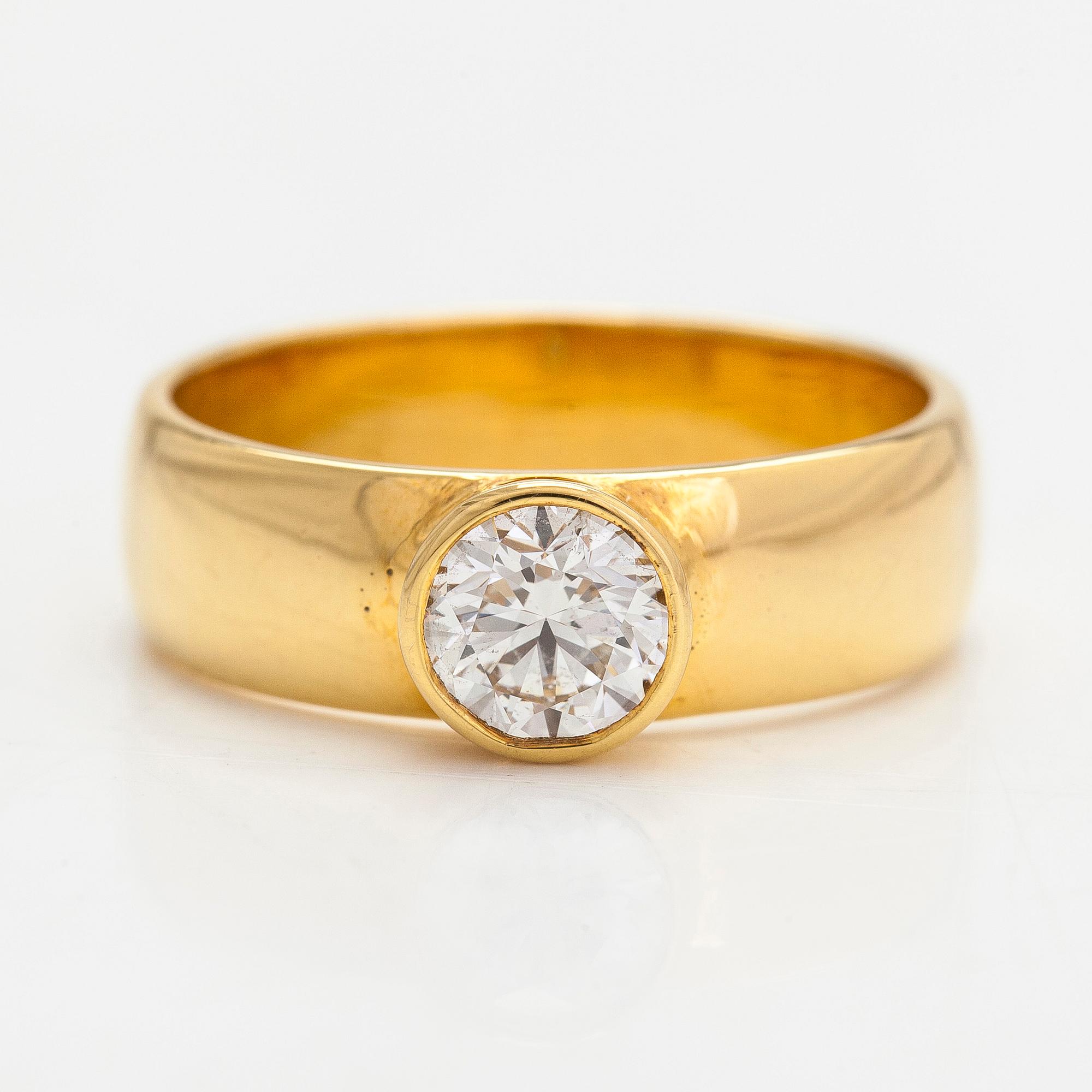 An 18K gold ring, with a brilliant-cut diamond approximately 1.11 ct with IDL certificate.