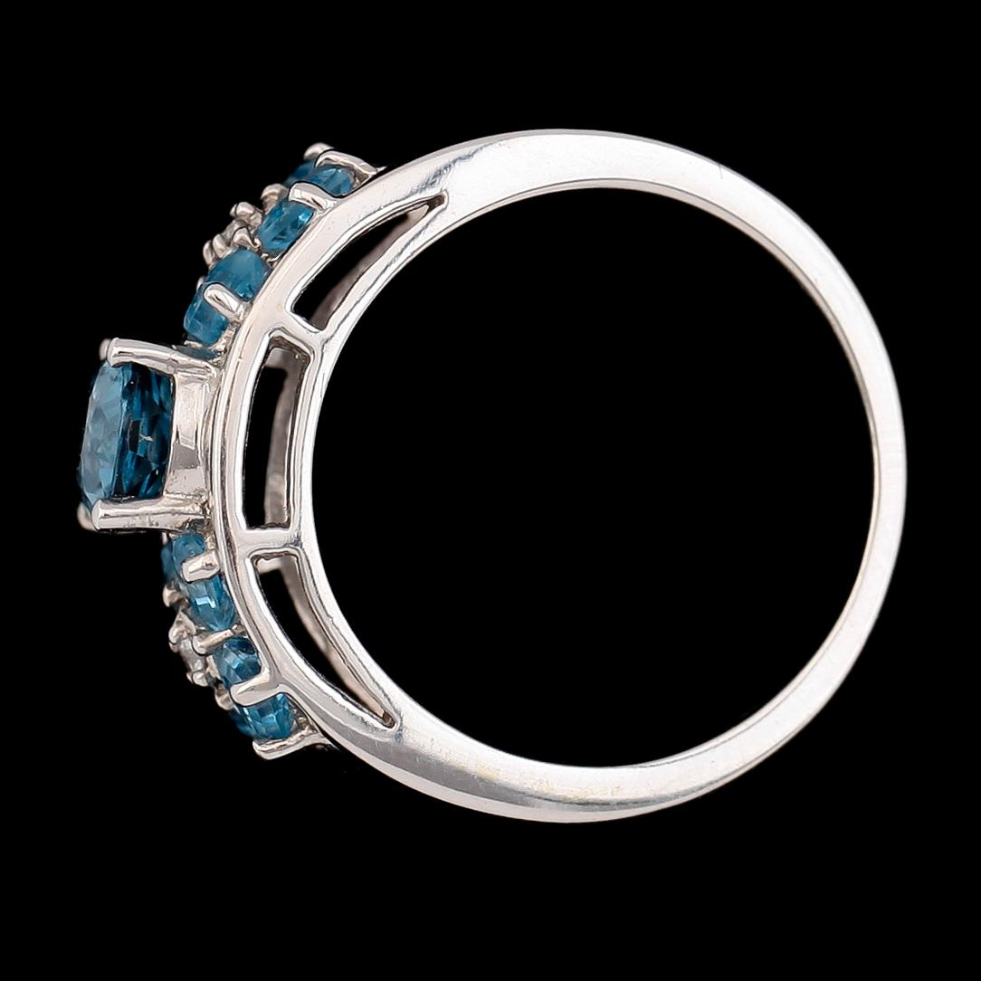 RING, 14K vitguld, turkosblå topaser samt diamanter.