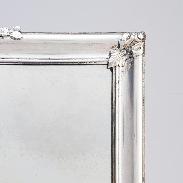 A Swedish Rococo mid-18th century mirror with silver frame  signed by Christian Precht.