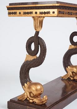 A Swedish Empire porphyry and giltwood console table, early 19th century.