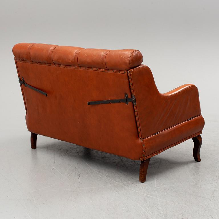 An early 20th century leather sofa.