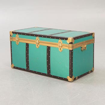 A mid 1900s metal trunk.