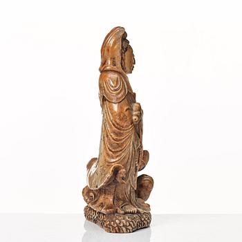 A soapstone sculpture of Guanyin with an attendant, Qing dynasty.