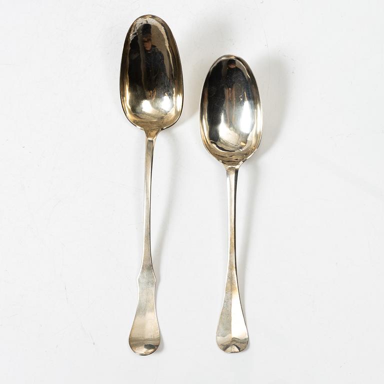 Two silver serving spoons with pseudo-marks, around the year 1900.