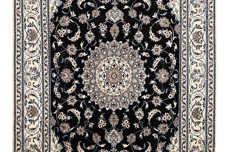 A carpet, Nain, part silk, ca 307 x 198 cm.