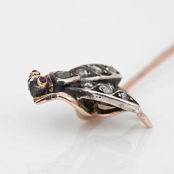 A Russian pin in the shape of an insect, set with rose-cut diamonds and rubies.