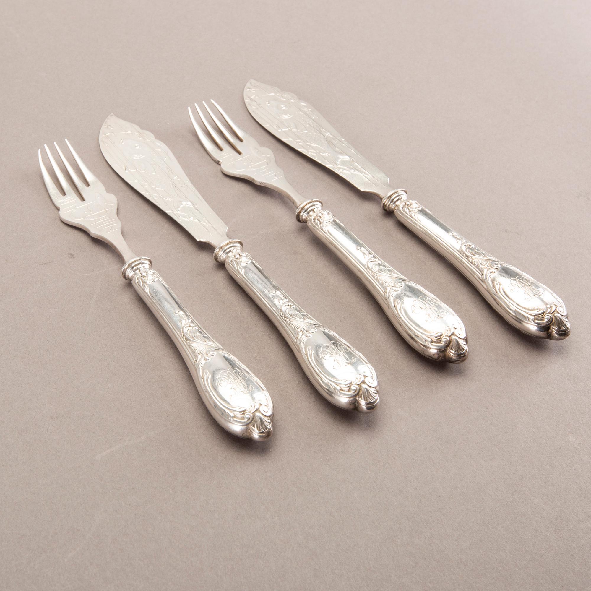 A German 20th century set of 12 fish cutlery low grade silver mark of F W Hespe hamburg early 1900s.