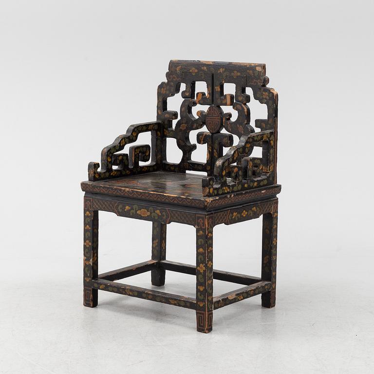 A Chinese lacquered chair, 20th Century.