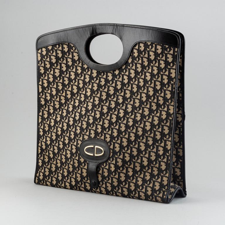 Christian Dior, Oblique fold-over convertible clutch.