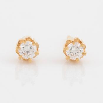 Brilliant cut diamond stud earrings.