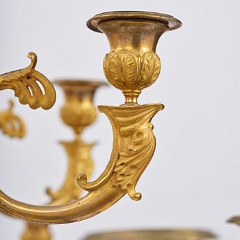 An ormolu and cut glass sixteen-branch Empire chandelier, Paris, early 19th century.