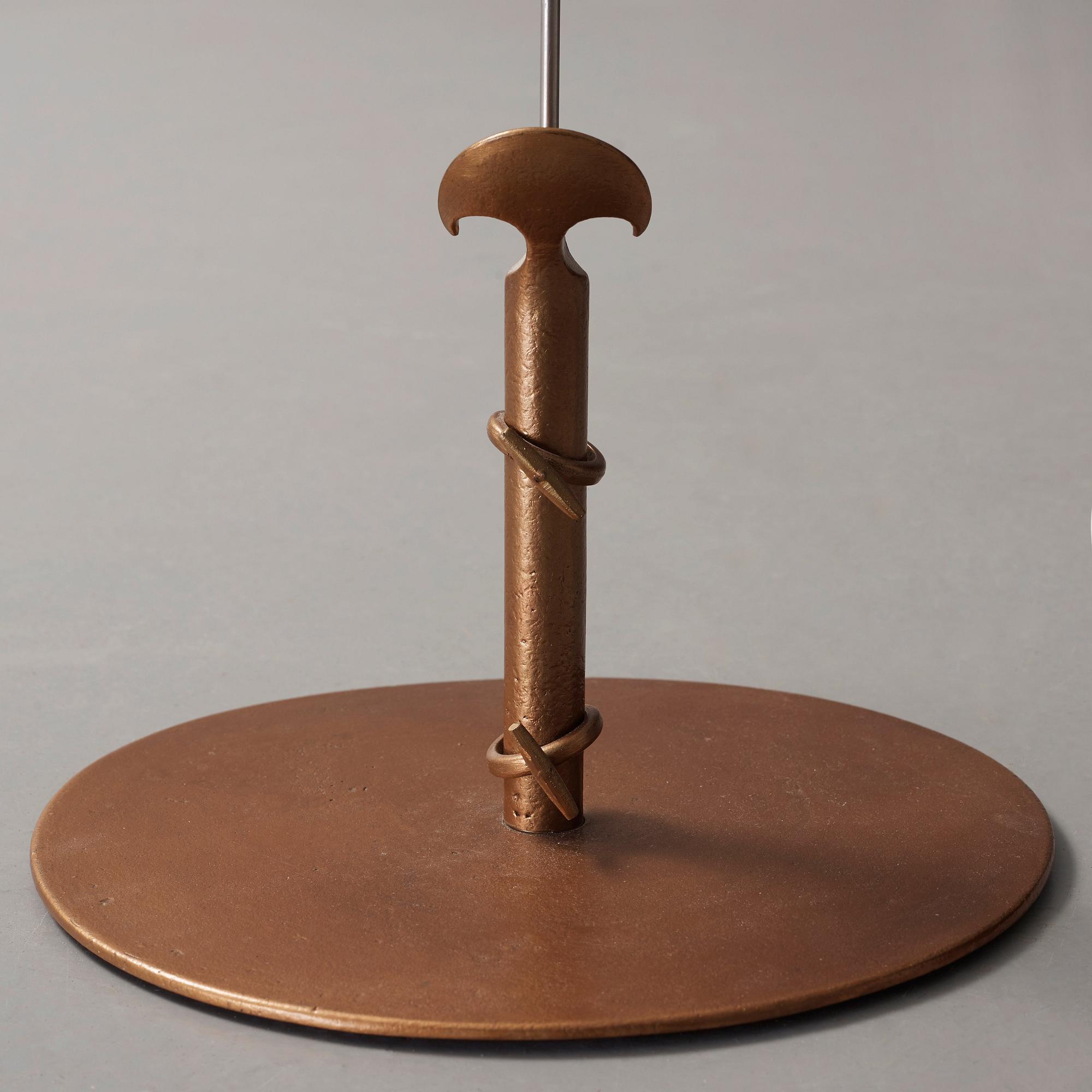 Tore Ahlsén, a bronze and white metal floor lamp, 'Napoleon on the Nile', probably executed by NK, 1940's.