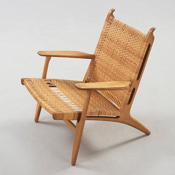 A Hans J Wegner oak and rattan easy chair 'CH-27', Carl Hansen & Son, Denmark,