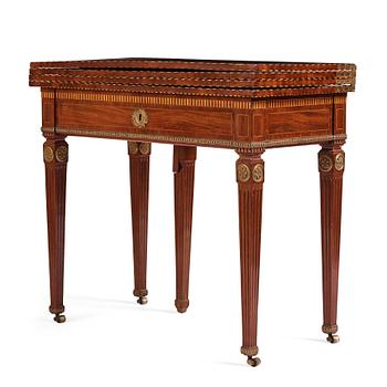 34. A Louis XVI north European games table, late 18th century.