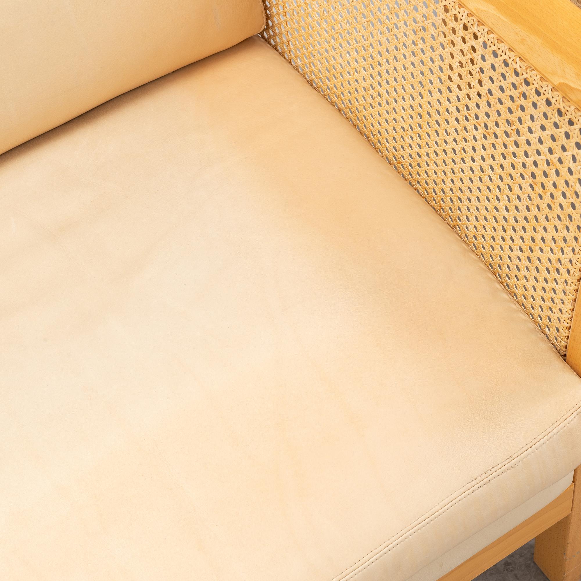A pair of 'Rotan' easy chairs by Arne Norell, end of the 20th Century.