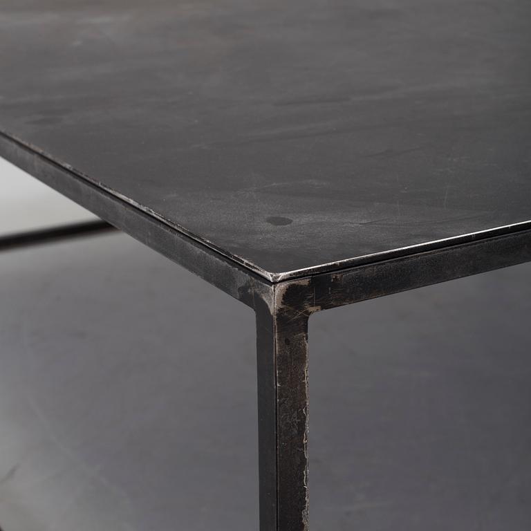 A modern square metal sofa table.