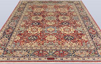 A Sarouk carpet, signed, approx. 327 x 253 cm.