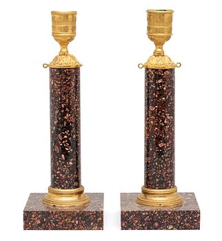 649. A pair of late Gustavian circa 1800 porphyry candlesticks.