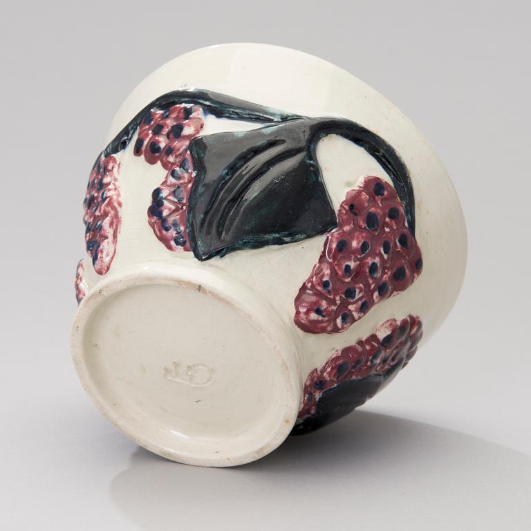 A ceramic bowl signed GT.