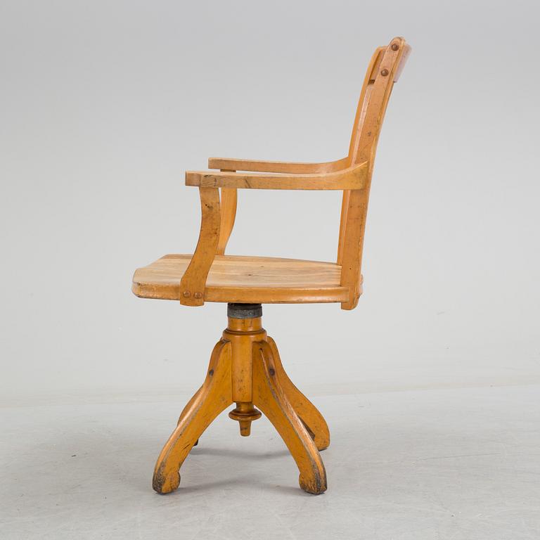 a writing desk chair from the early 20th century.