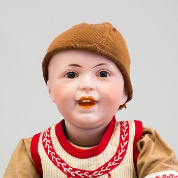 A bisque headed boy doll 235 by S.F.B.J, Paris, France, 1910s.