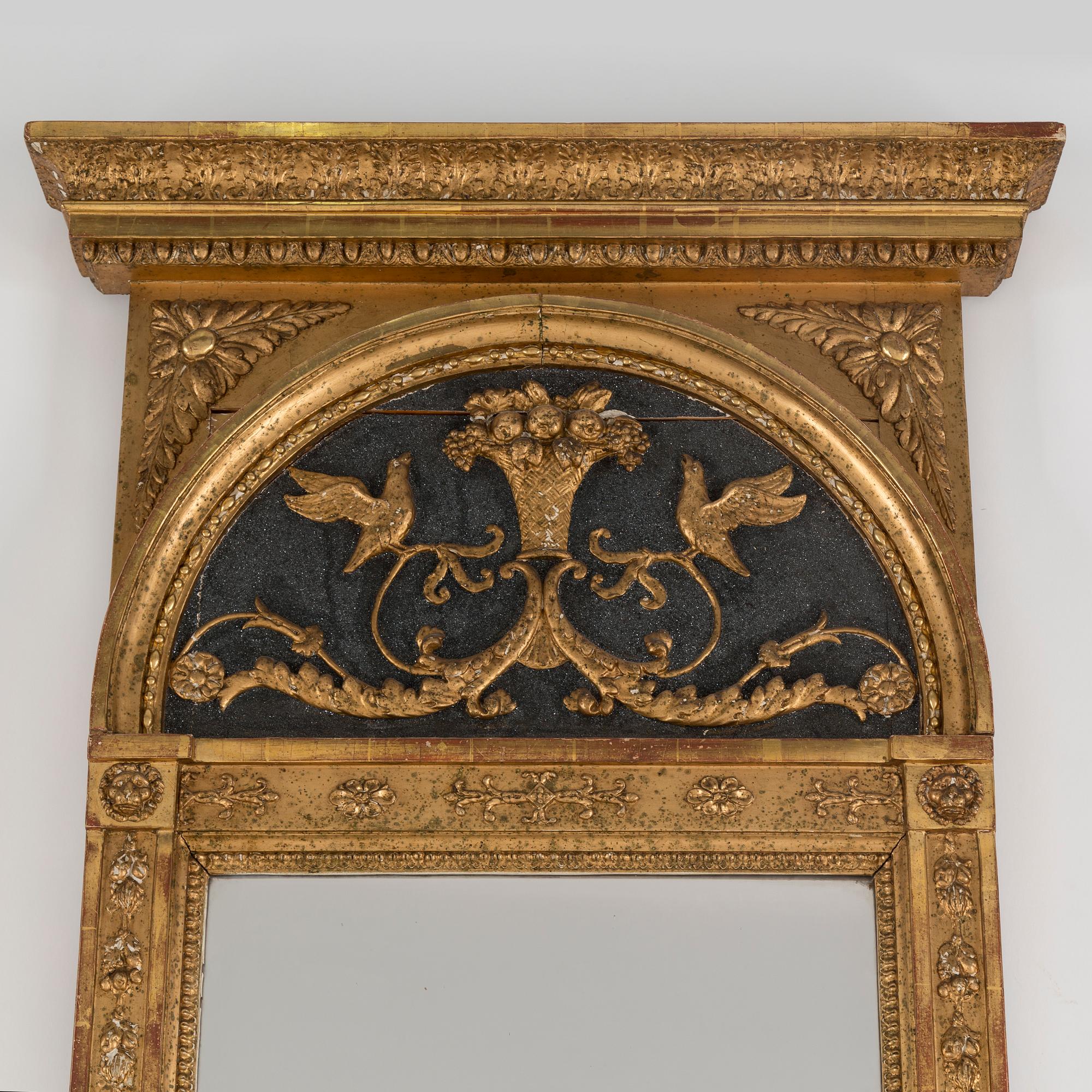A gilt mirror dated 1816 by CM Fogelgren, linköping with a console table.