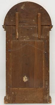 An Empire mirror, early 19th Century.