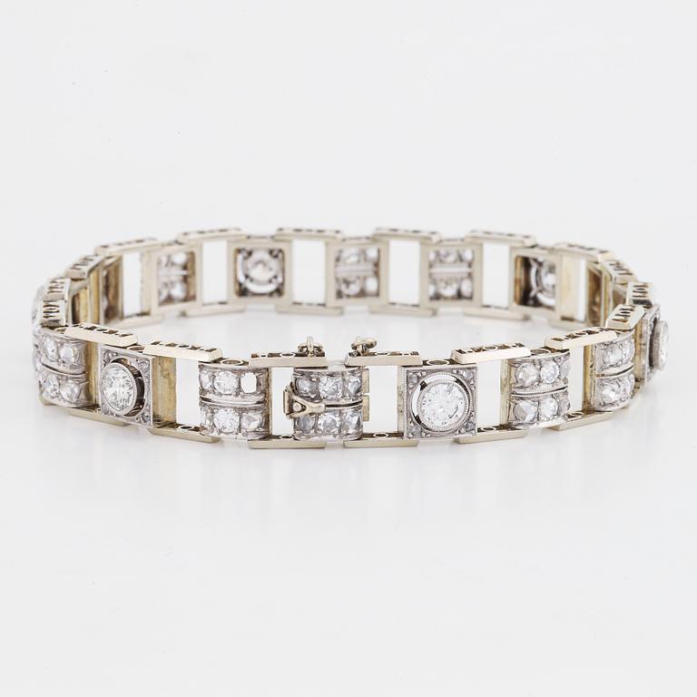 An 18K white gold bracelet set with old- and rose-cut diamonds.