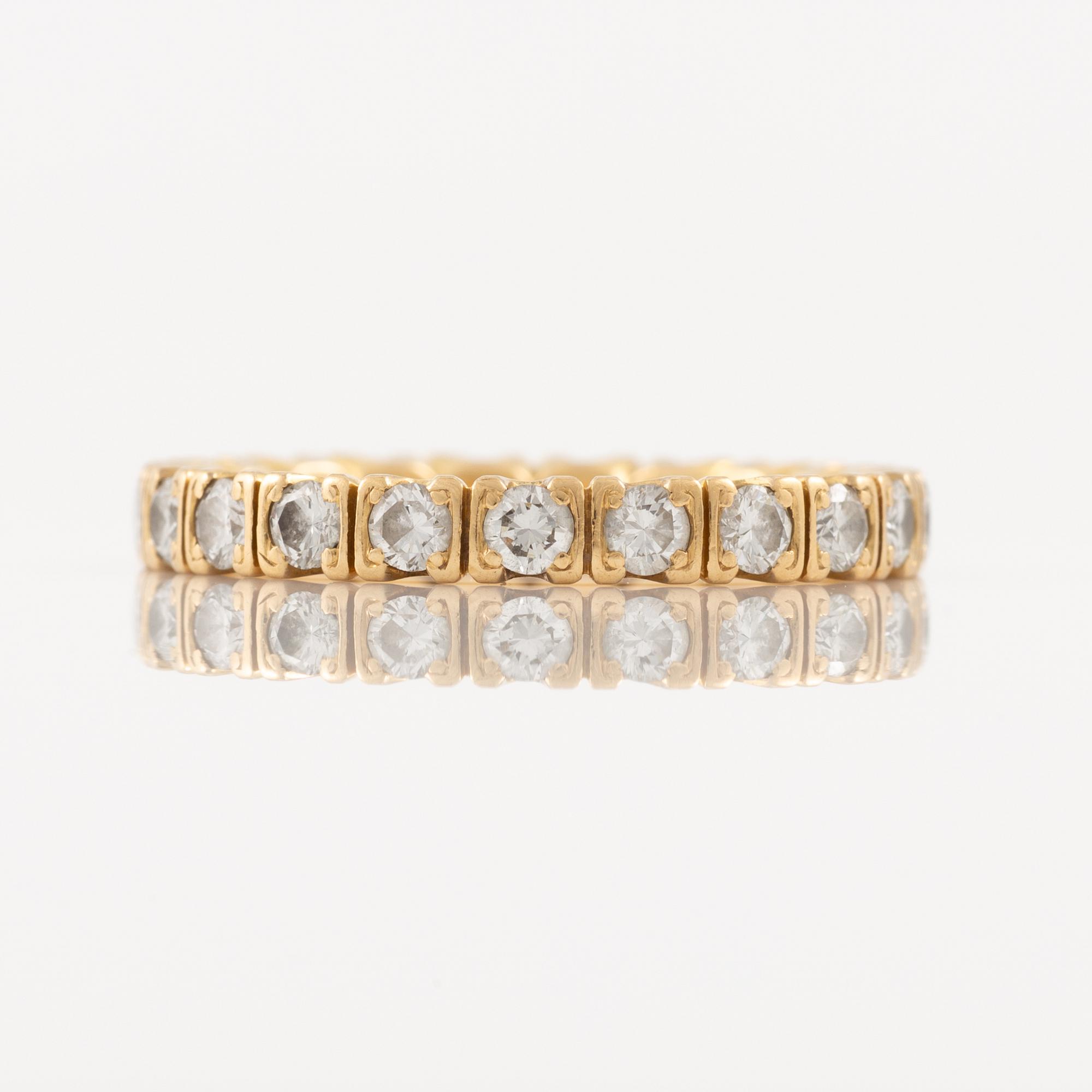 Ring in 18K gold set with round brilliant-cut diamonds, eternity band.