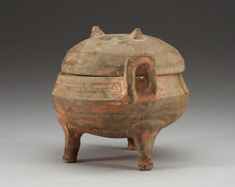 A potted ding tripod censer with cover, Han dynasty (206 BC - 220 AD).