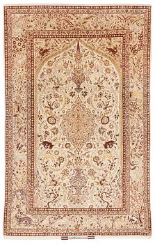 A signed part silk Esfahan rug, ca 233 x 147 cm (as well as 3 cm flat weave on each side).