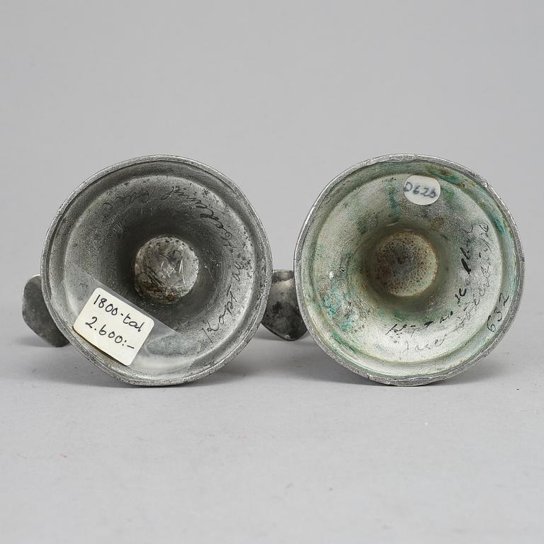A pair of 19th century pewter candlesticks.