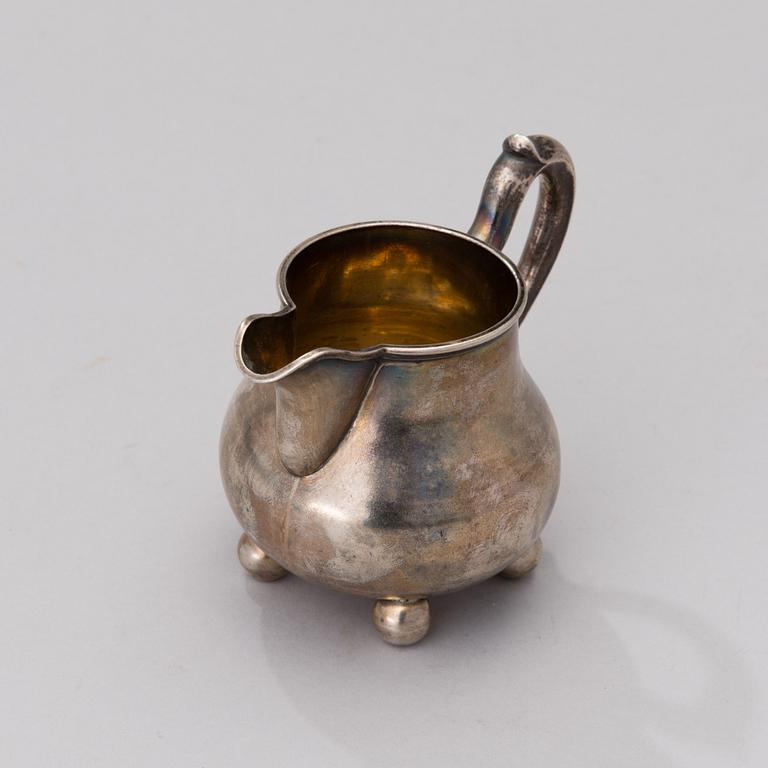 A RUSSIAN CREAM JUG, silver, St:Petersburg 1887, Nikolai Kemper.