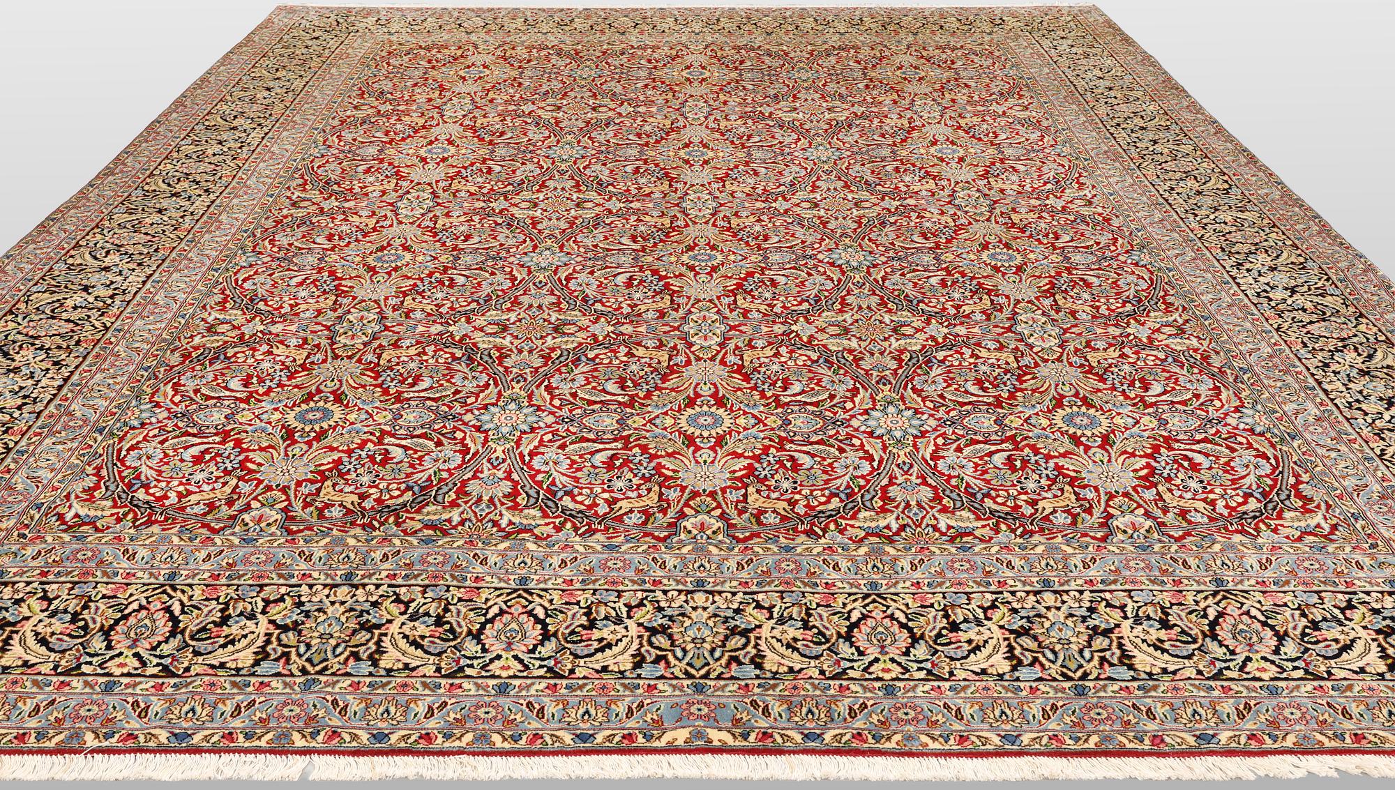 A Kirman lavar carpet, 403 x 304 cm.