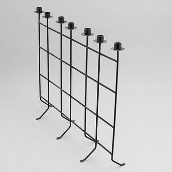 An iron candlestick, second half of the 20th Century.